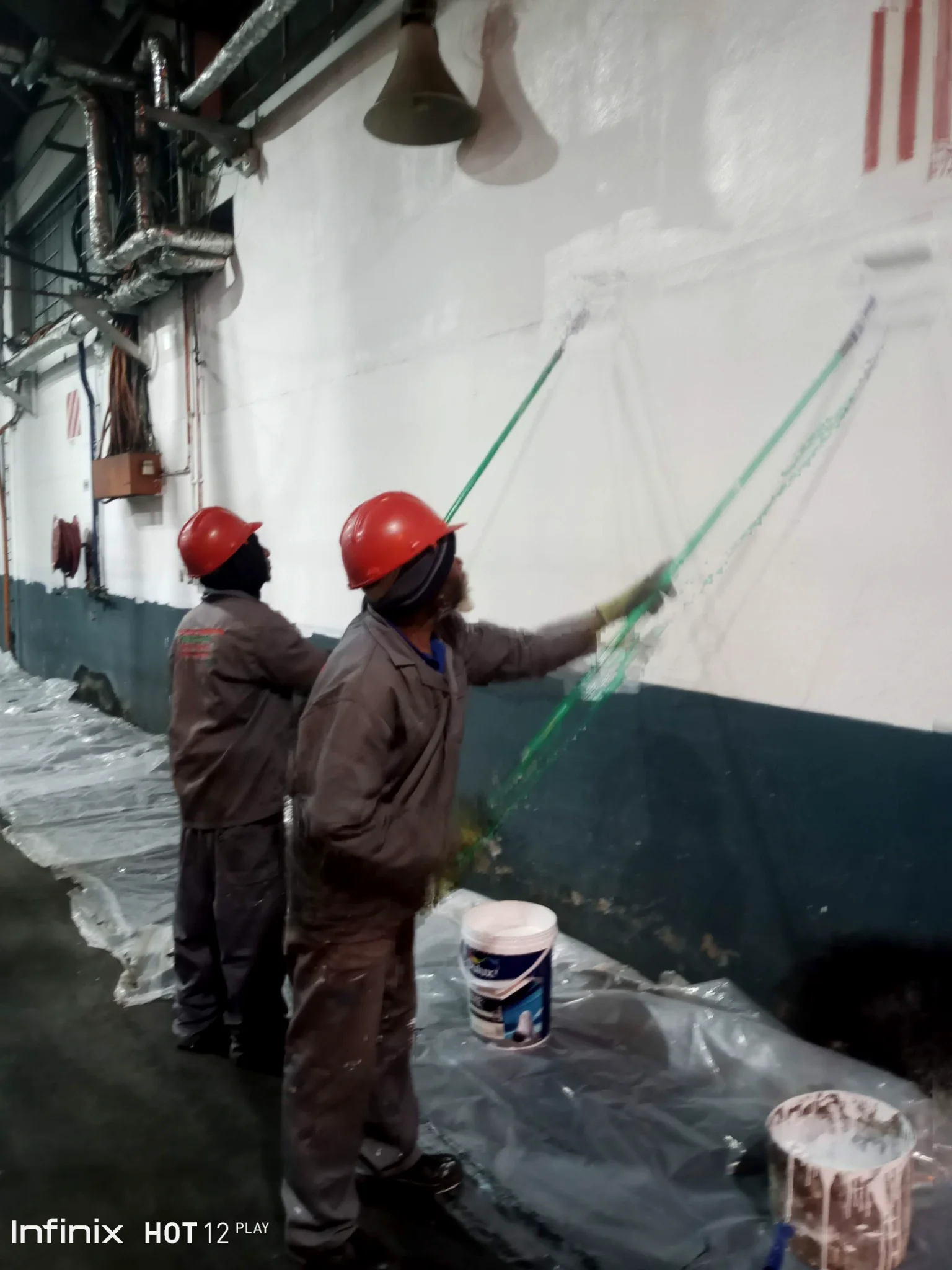 Engineering team carrying out industrial surface works