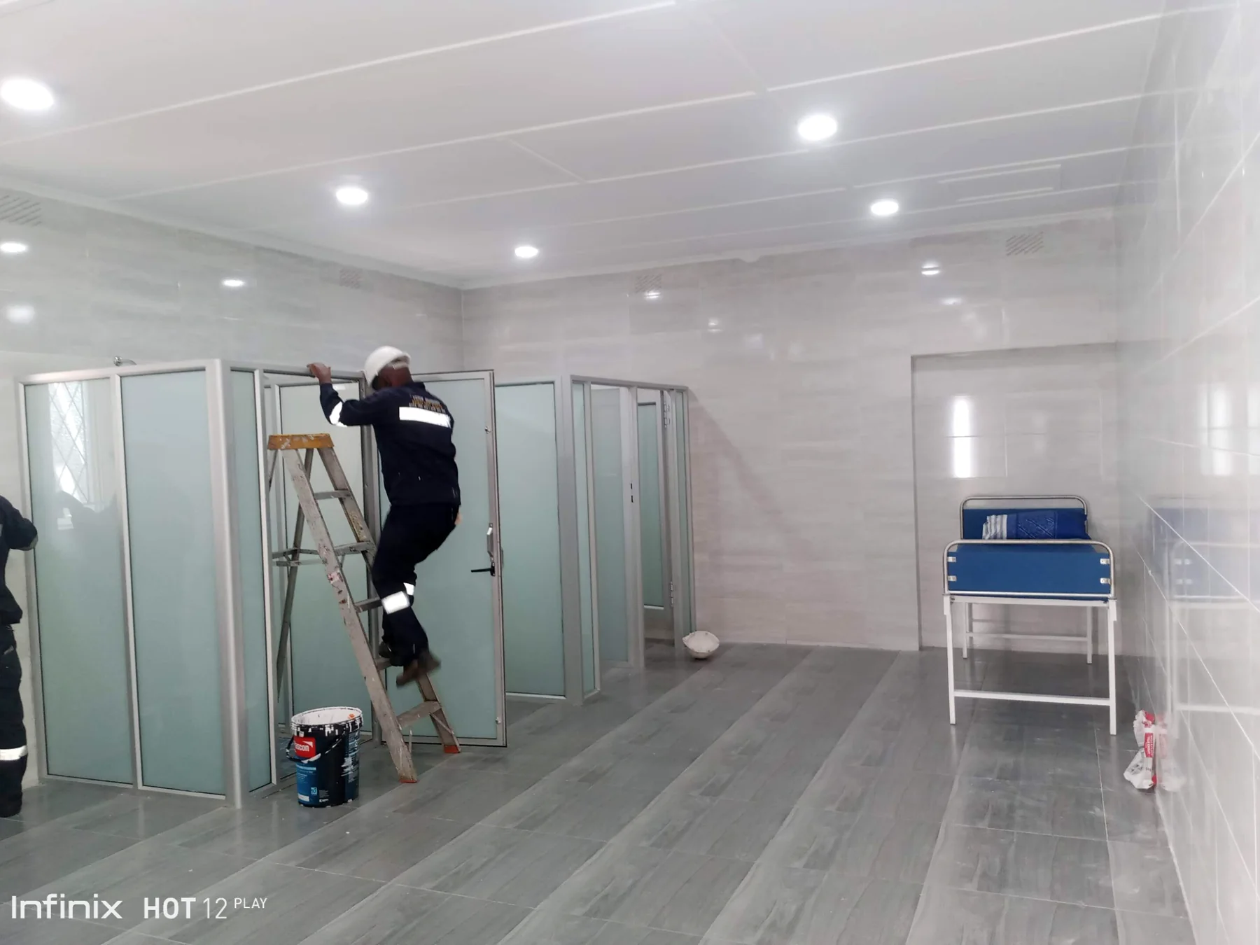 Washroom partition installation during refurbishment